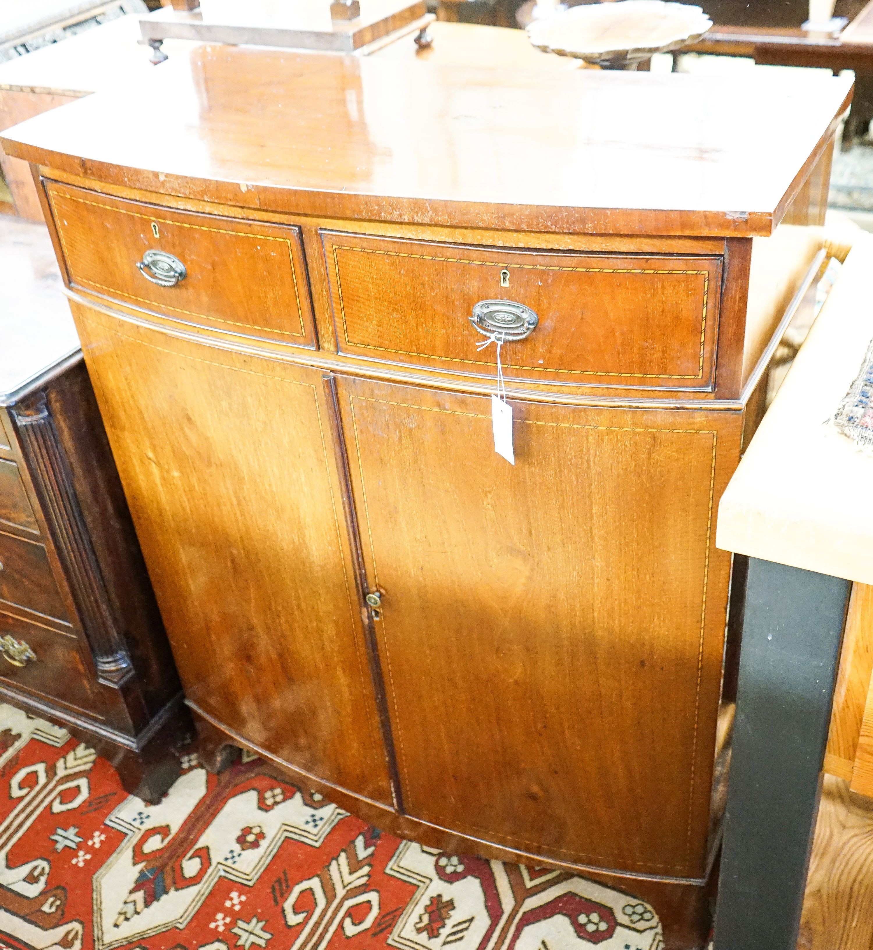 An Edwardian mahogany bowfront side cabinet, width 92cm, depth 47cm, height 113cm